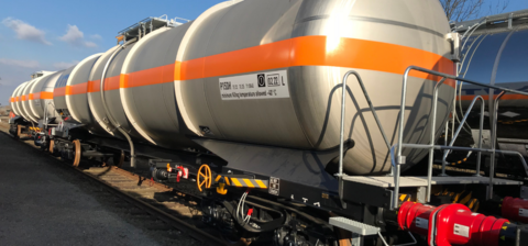 Gray tank car with orange stripe all around